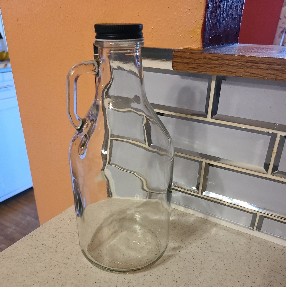 Vintage Clear Glass Bottle with Black Lid